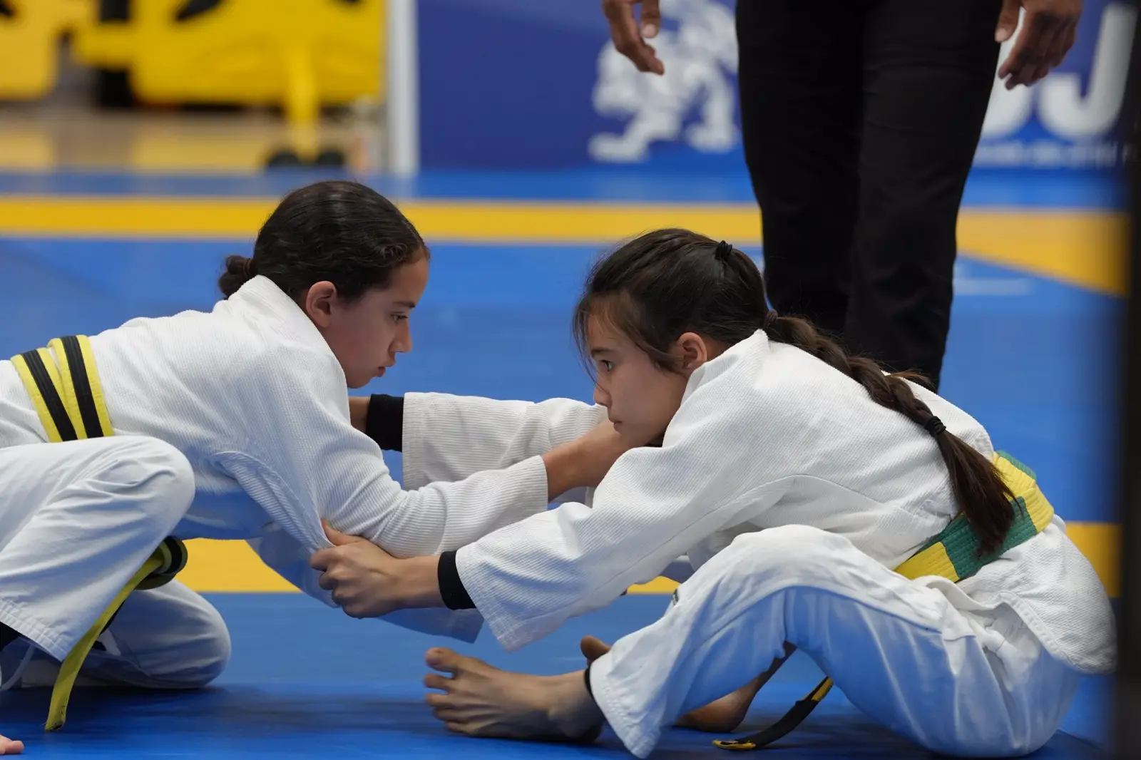 Bailey Heinsohn competing in a Brazilian Jiu-Jitsu match in the gi.